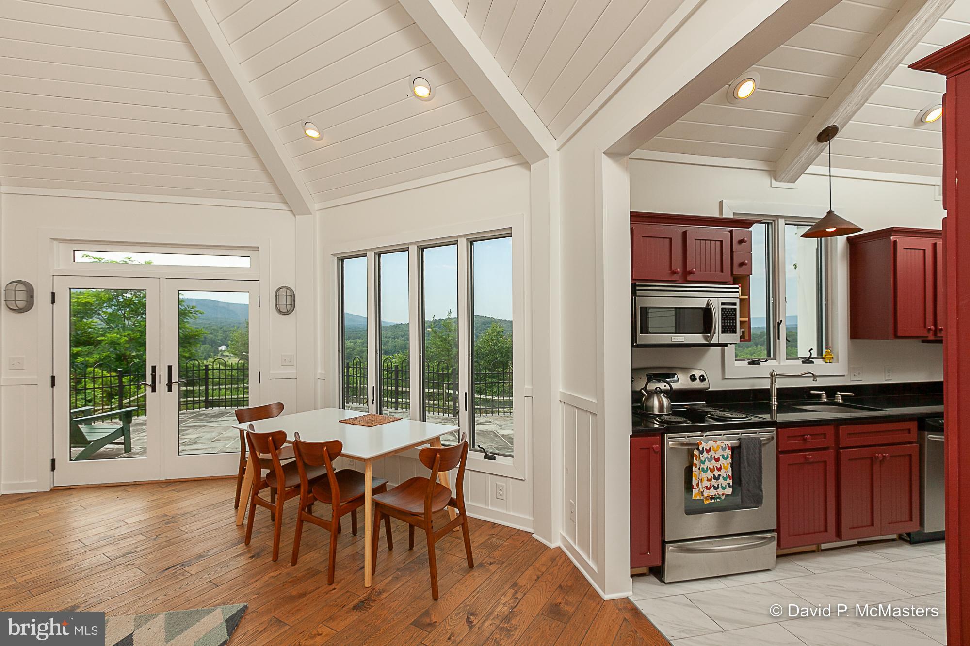 2925 Spohrs Road Berkeley Springs, WV 25411 - Photo 18 of 41 Opens to kitchen Vaulted ceiling S/S appliances