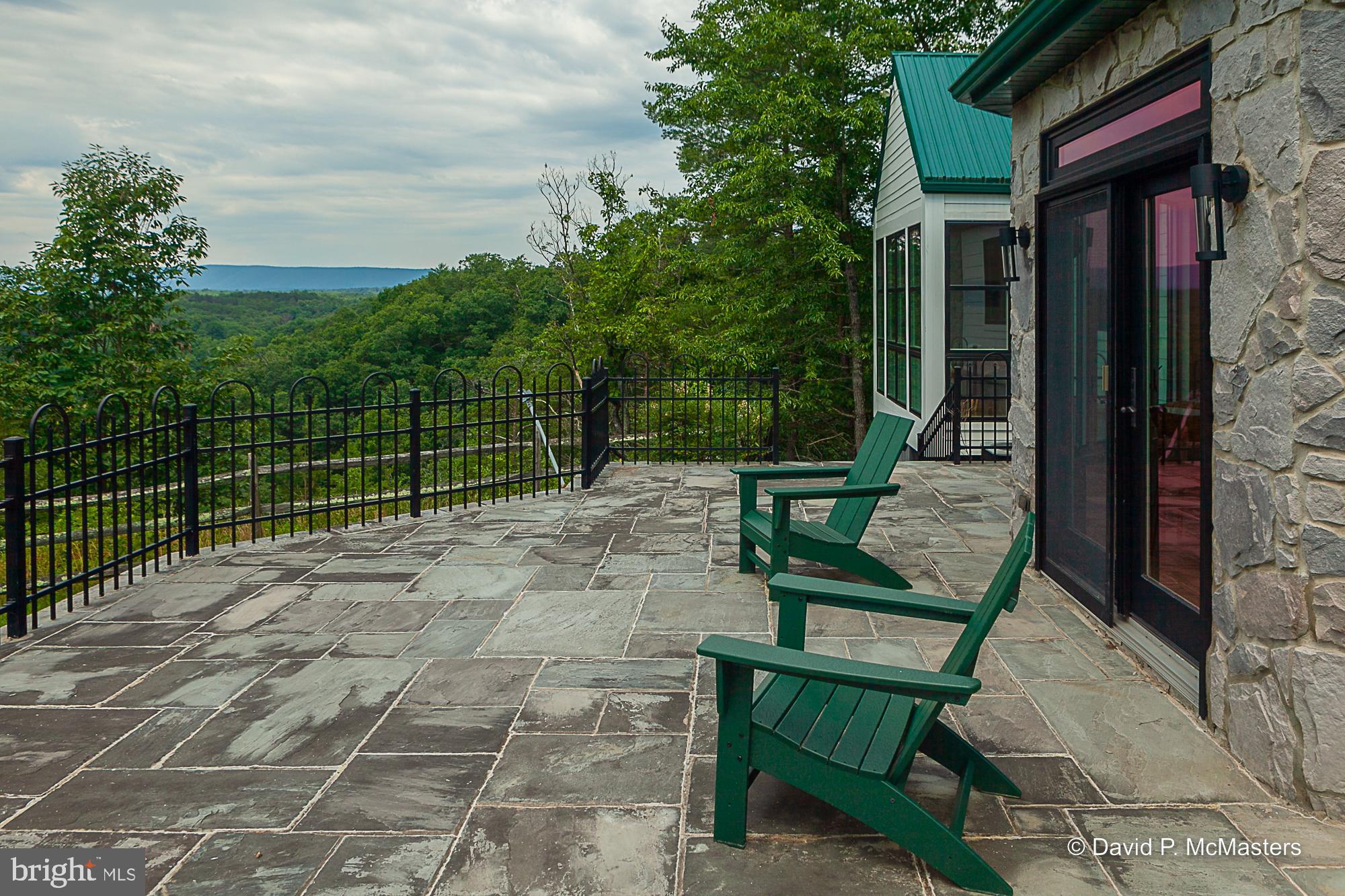 2925 Spohrs Road Berkeley Springs, WV 25411 - Photo 19 of 41 Huge stone/slate fenced terrace. 180 degree view