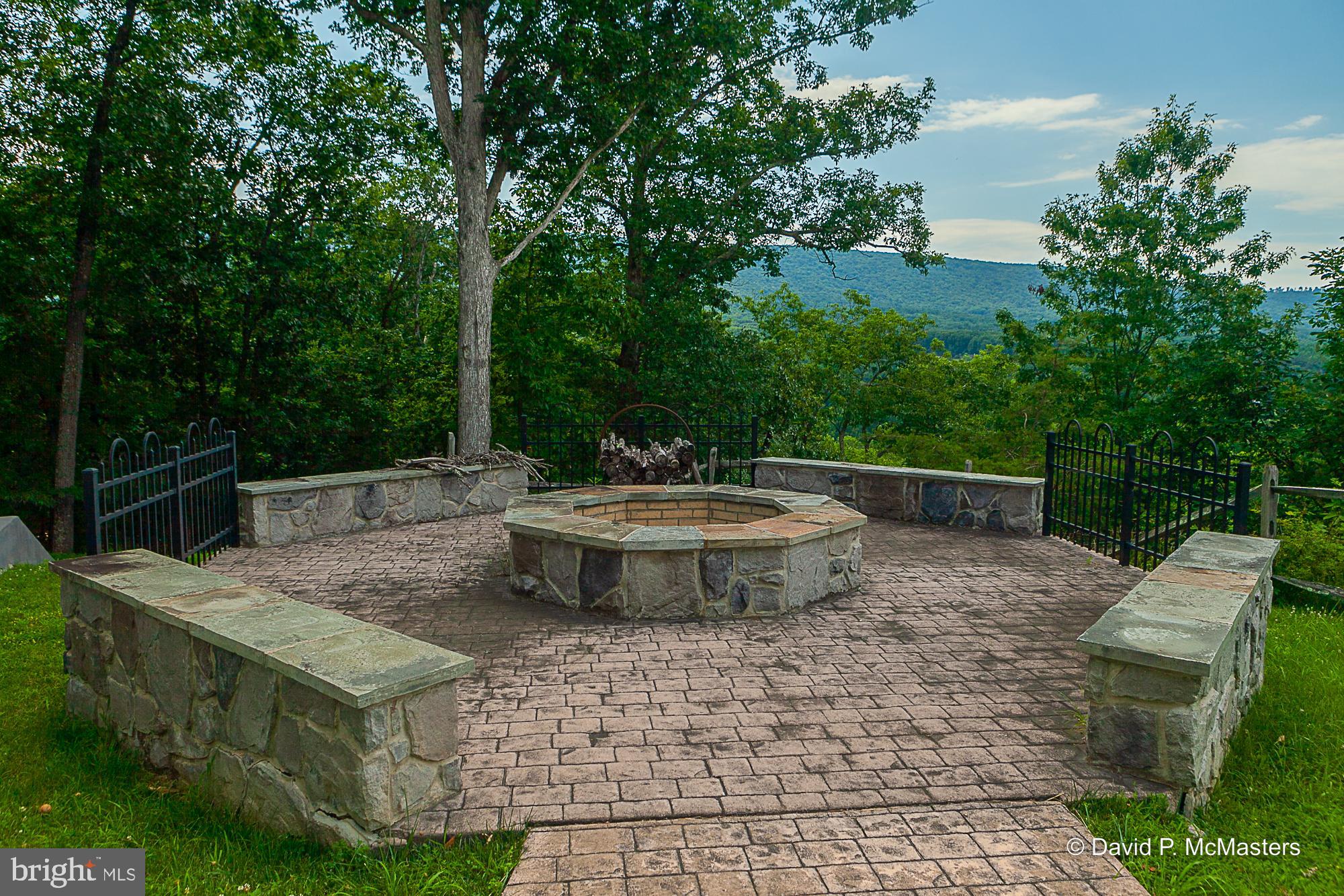 2925 Spohrs Road Berkeley Springs, WV 25411 - Photo 23 of 41 Huge fire pit with seating off terrace