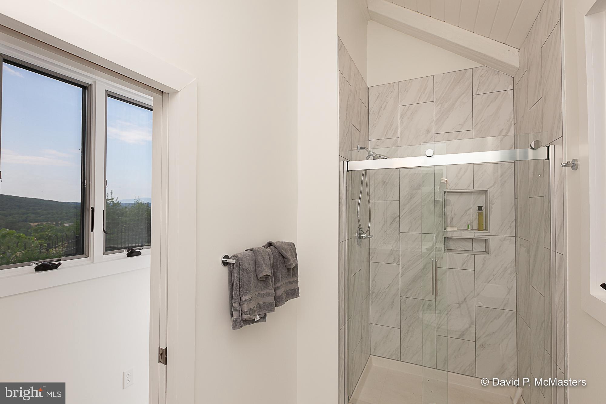 2925 Spohrs Road Berkeley Springs, WV 25411 - Photo 32 of 41 First fl bath. Walk in shower Ceramic tile floors
