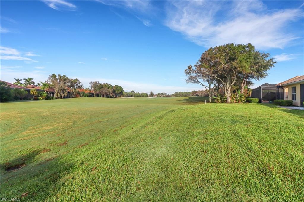 6757 Bent Grass Drive Naples, FL 34113 - Photo 27 of 27 a view of a big yard with a house in the background