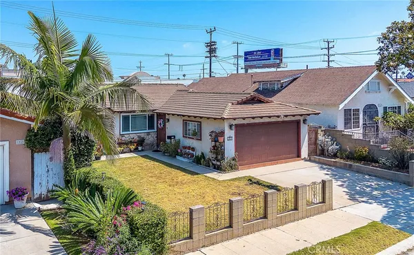 a aerial view of a house with swimming pool and furniture