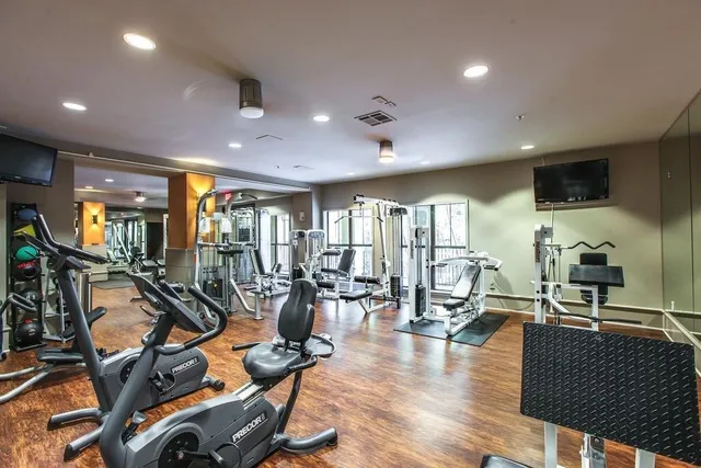 a backyard of a house with yard and outdoor seating