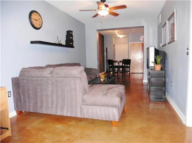 a living room with furniture and a table