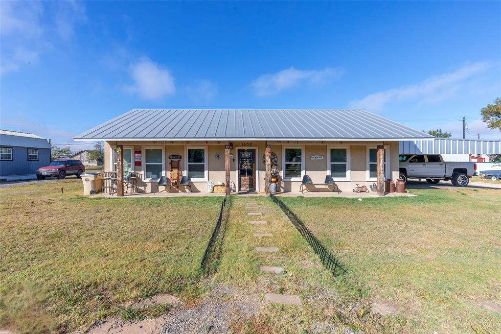 Welcome Home! Located on a large corner lot with a detached carport 