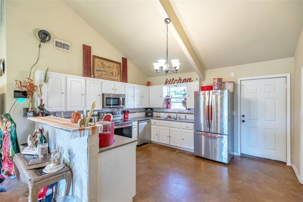 1502 Avenue North Anson, TX 79501 - Photo 13 of 20 a view of a kitchen and utility room