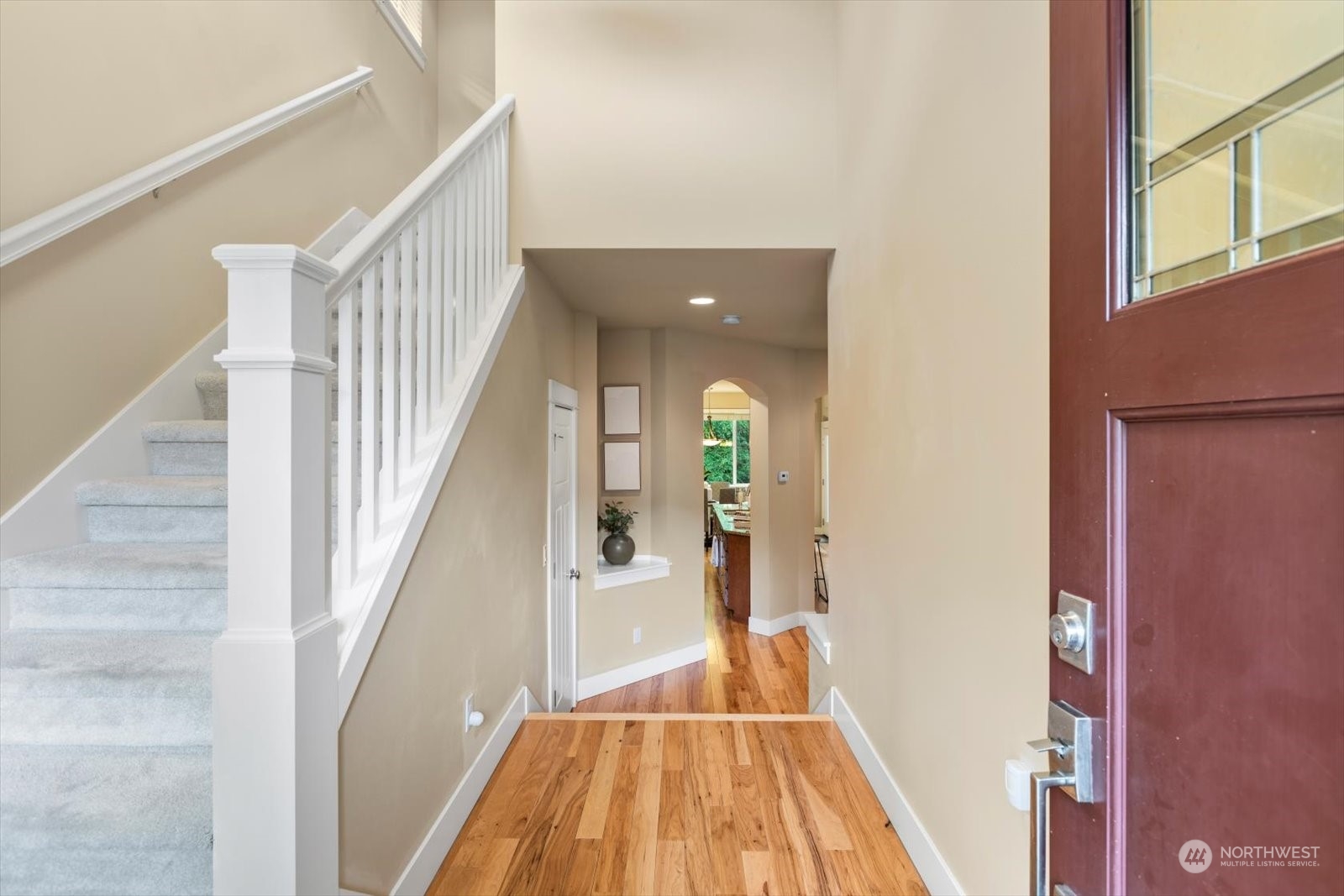3614 232nd Street Southeast Bothell, WA 98021 - Photo 3 of 29 a view of a hallway with wooden floor and staircase
