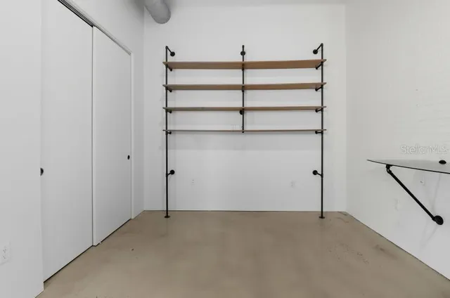 a bathroom with a glass shower door