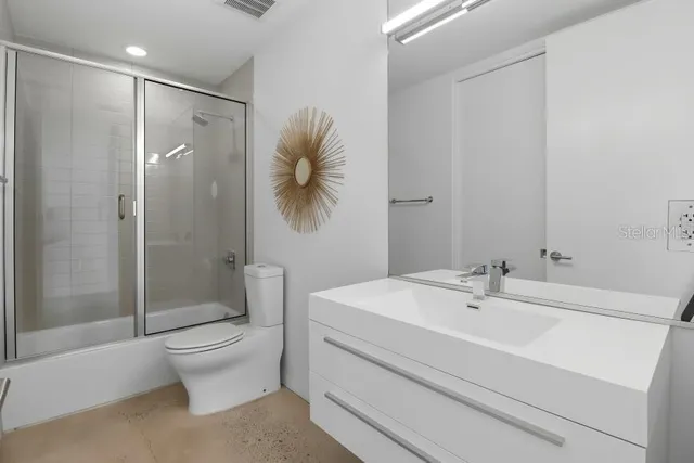 a bathroom with a bathtub and a sink