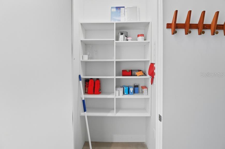 302 Southeast Broadway Street, Unit 460 Ocala, FL 34471 - Photo 31 of 47 a room with a shelf