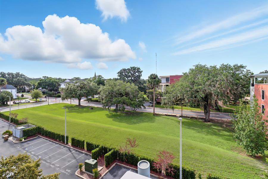302 Southeast Broadway Street, Unit 460 Ocala, FL 34471 - Photo 35 of 47 a view of a golf course with a swimming pool