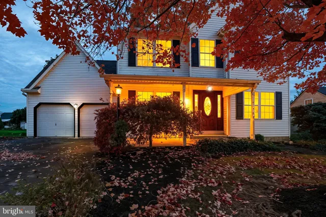 a front view of house with green space