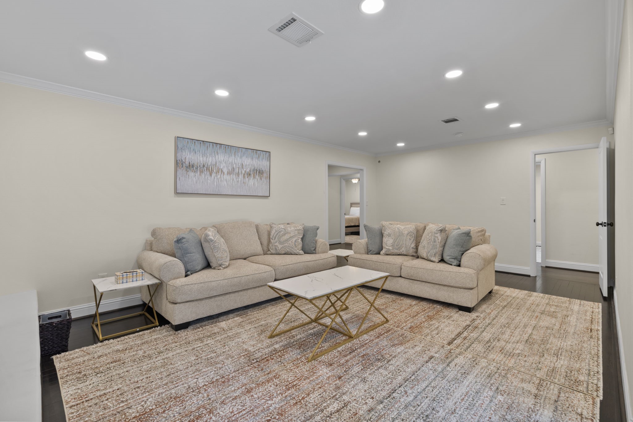 2402 Chimney Rock Road Houston, TX 77057 - Photo 21 of 36 Spacious secondary living area with recessed lighting, neutral tones, and stylish finishes. Perfect for a game room, media space, or flexible living area with easy access to nearby bedrooms.