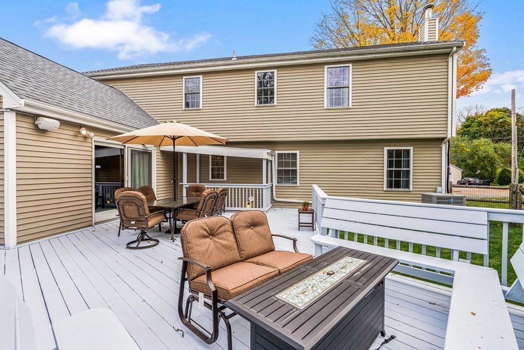 53 Elder Road Needham, MA 02494 - Photo 28 of 33 a front view of a house with patio outdoor seating