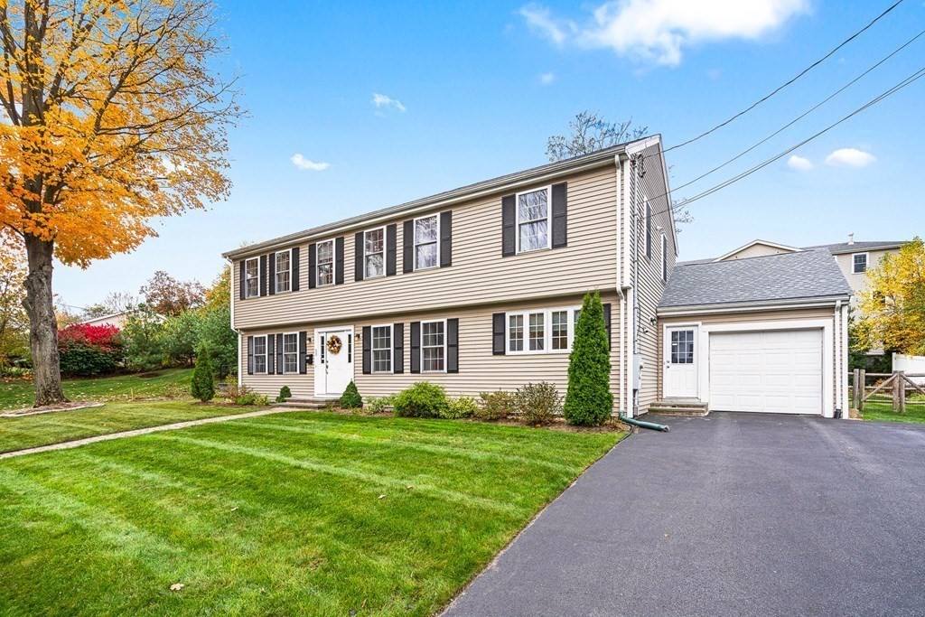 53 Elder Road Needham, MA 02494 - Photo 29 of 33 a front view of a house with garden and porch