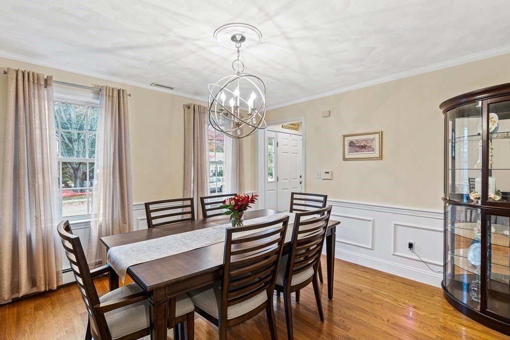 53 Elder Road Needham, MA 02494 - Photo 3 of 33 a view of a dining room with furniture wooden floor and chandelier