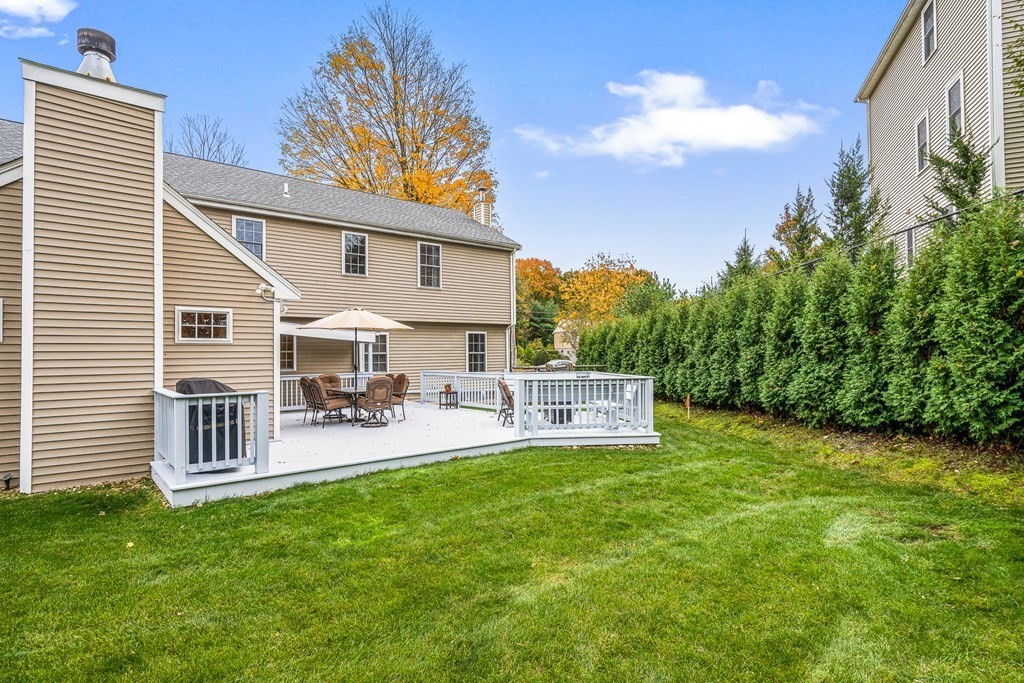 53 Elder Road Needham, MA 02494 - Photo 32 of 33 a view of a house with backyard and sitting area