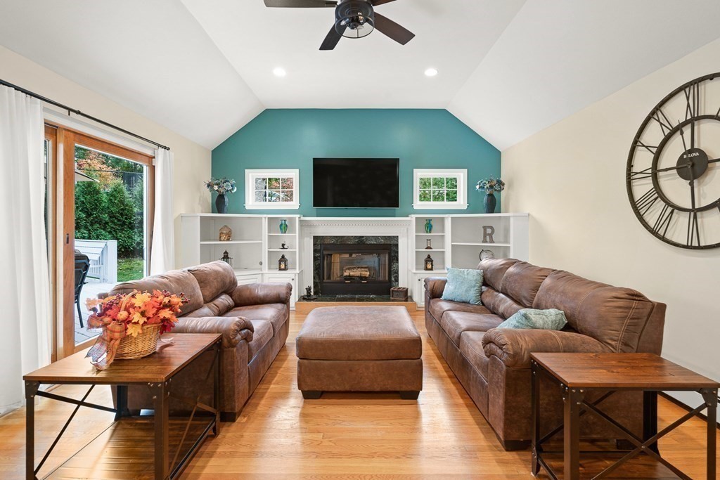 53 Elder Road Needham, MA 02494 - Photo 10 of 33 a living room with furniture flat screen tv and a fireplace