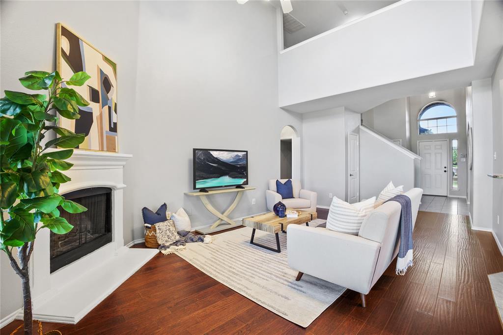 14904 Riverside Drive Little Elm, TX 75068 - Photo 11 of 28 a living room with furniture fireplace and potted plant