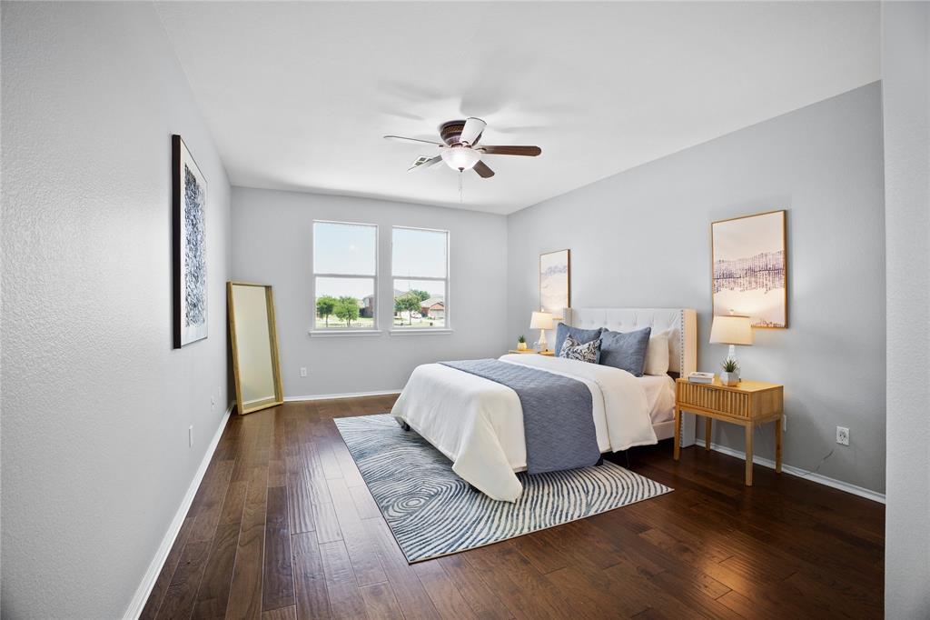 14904 Riverside Drive Little Elm, TX 75068 - Photo 14 of 28 a spacious bedroom with a bed and a window