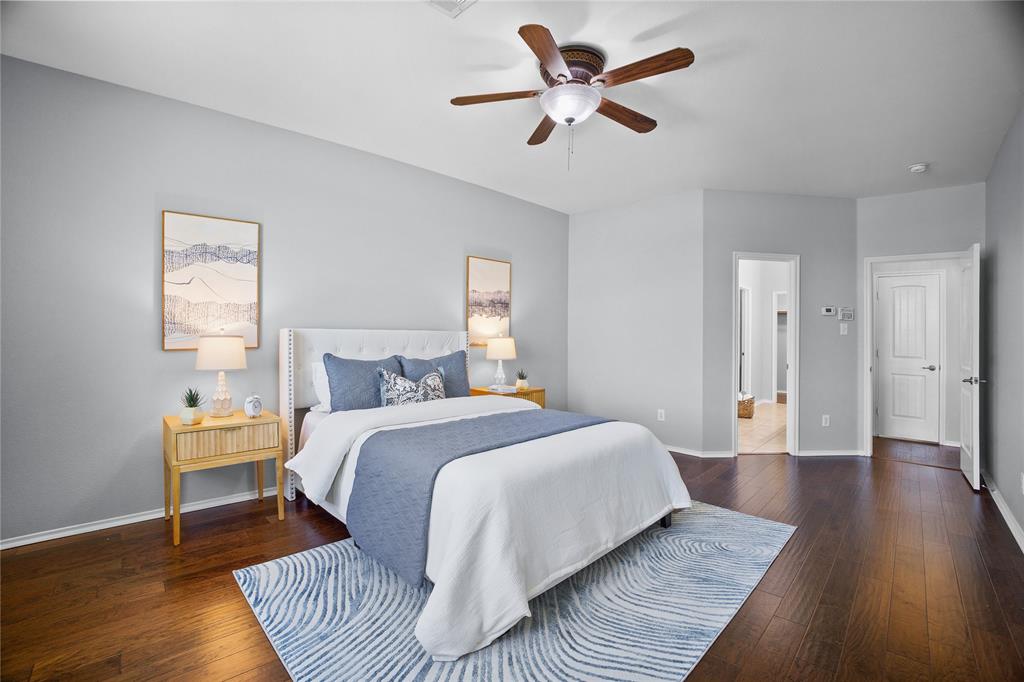 14904 Riverside Drive Little Elm, TX 75068 - Photo 15 of 28 a spacious bedroom with a bed and a window