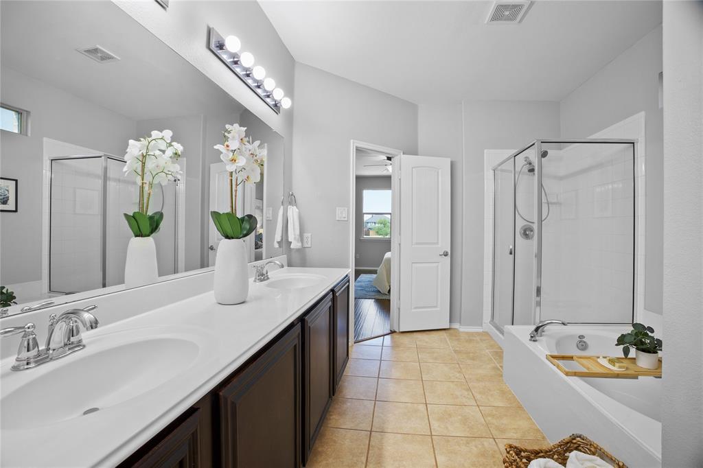 14904 Riverside Drive Little Elm, TX 75068 - Photo 17 of 28 a spacious bathroom with a double vanity sink mirror and shower