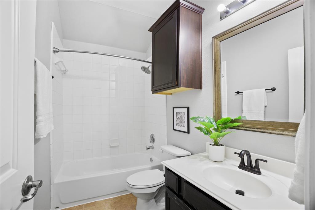 14904 Riverside Drive Little Elm, TX 75068 - Photo 22 of 28 a bathroom with a sink toilet and shower