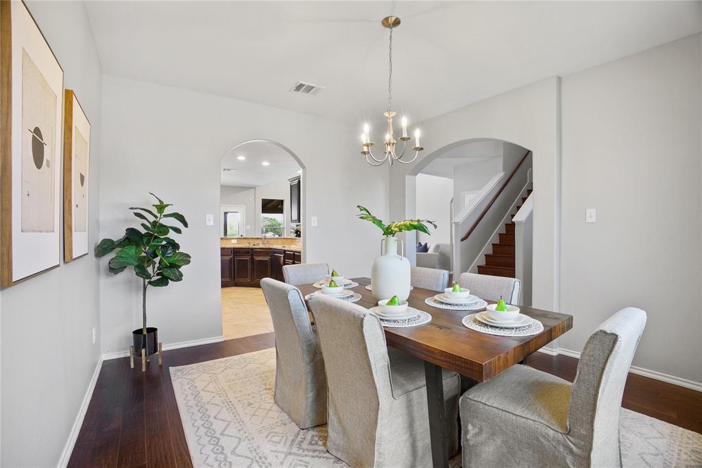 14904 Riverside Drive Little Elm, TX 75068 - Photo 6 of 28 a view of a dining room with furniture and chandelier