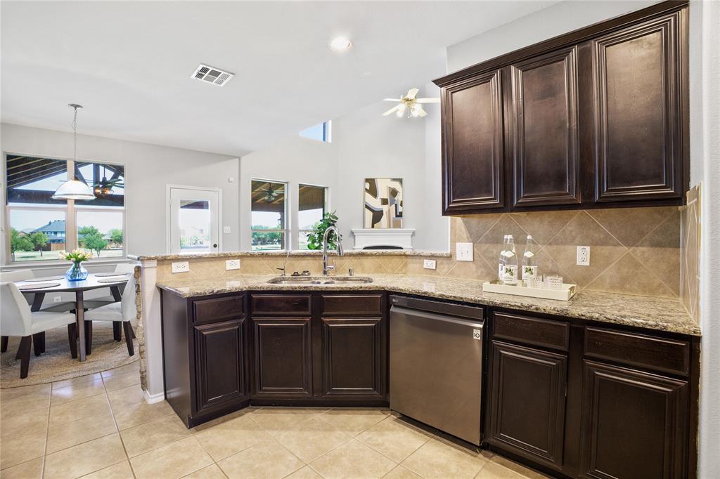 14904 Riverside Drive Little Elm, TX 75068 - Photo 9 of 28 a kitchen with a sink and cabinets