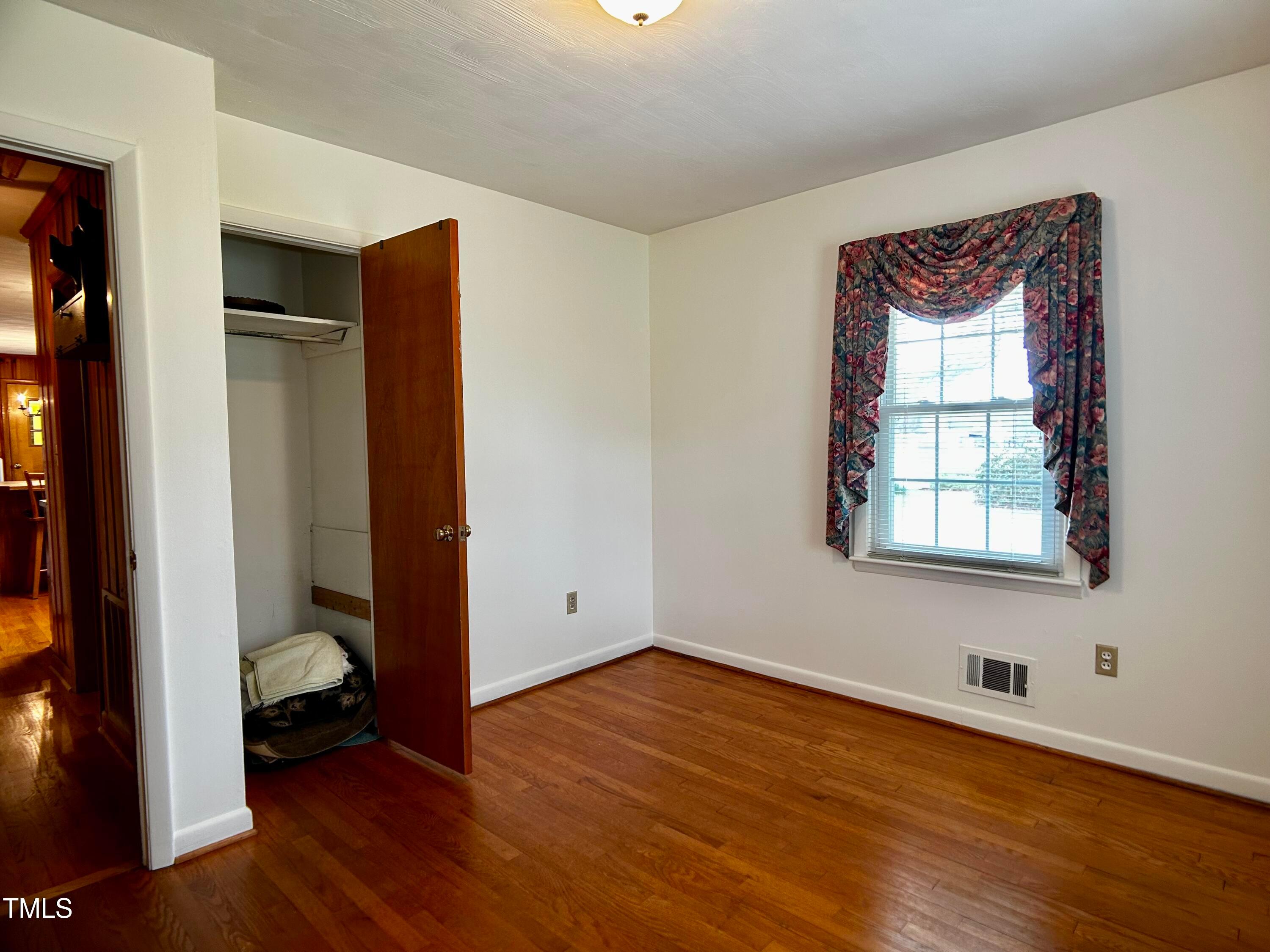 2981 Barber Mill Road Clayton, NC 27520 - Photo 16 of 28 a bedroom with a bed and a window