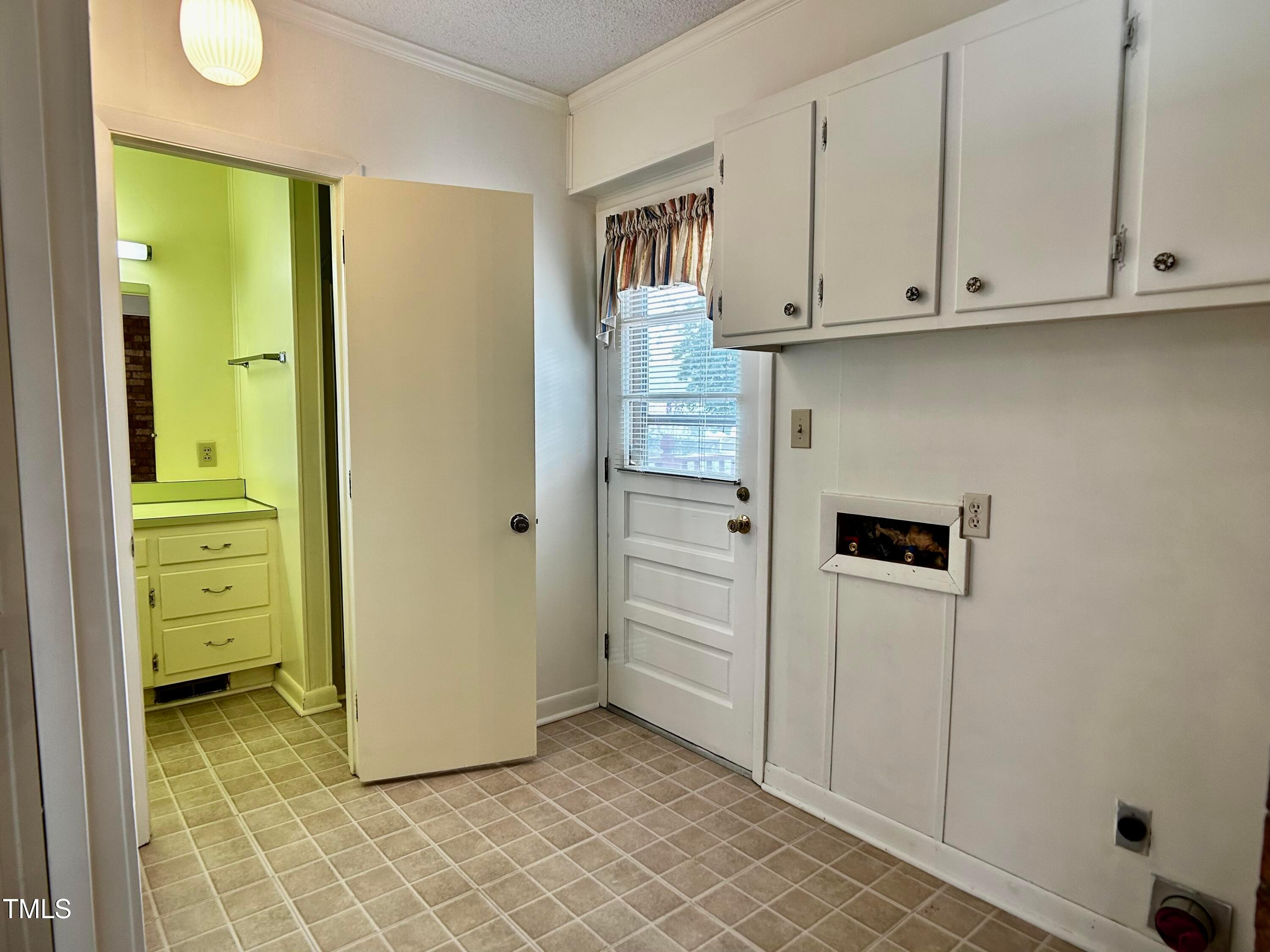 2981 Barber Mill Road Clayton, NC 27520 - Photo 18 of 28 a view of cabinets and utility room