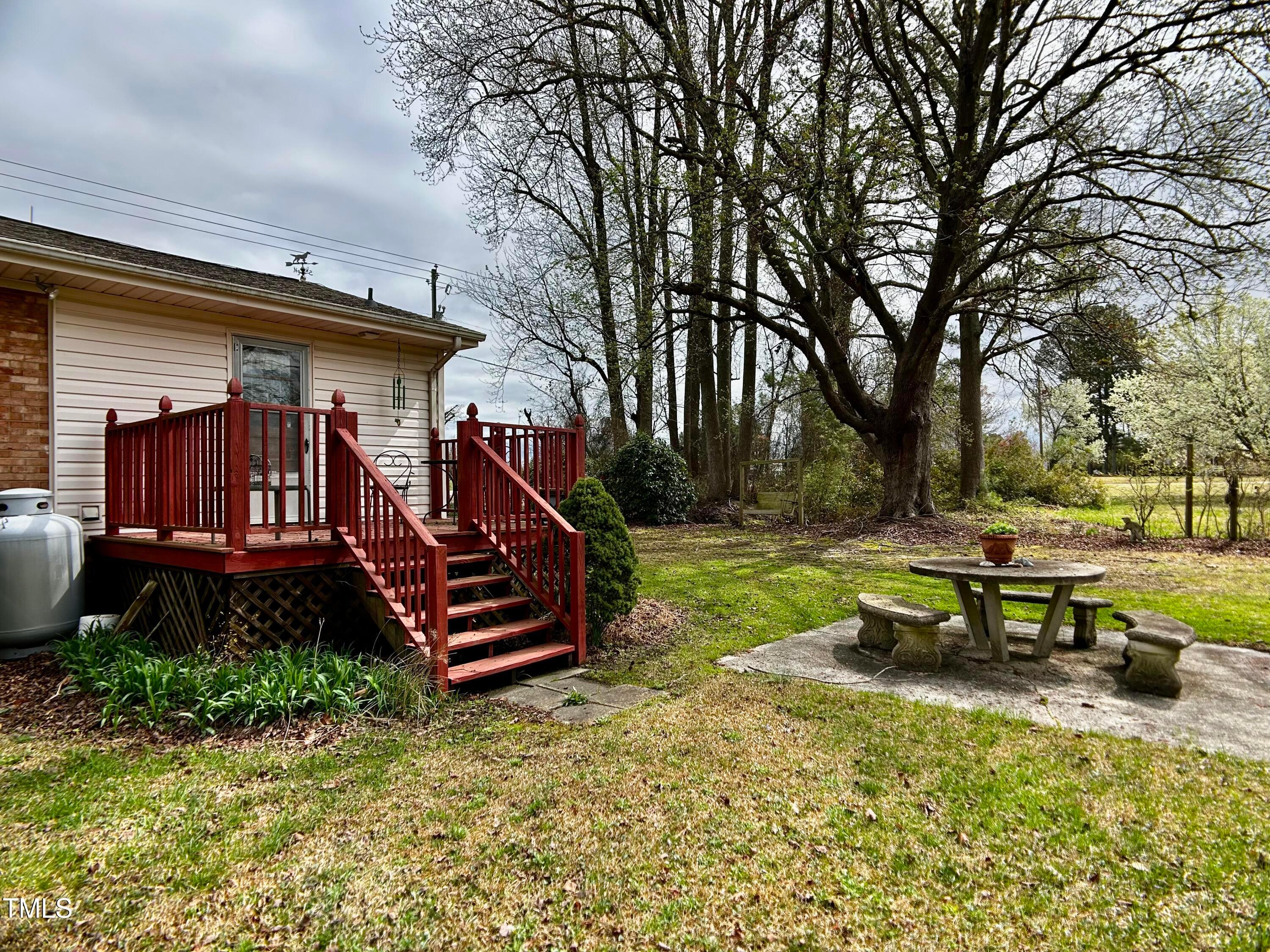 2981 Barber Mill Road Clayton, NC 27520 - Photo 21 of 28 a view of a bench in a backyard