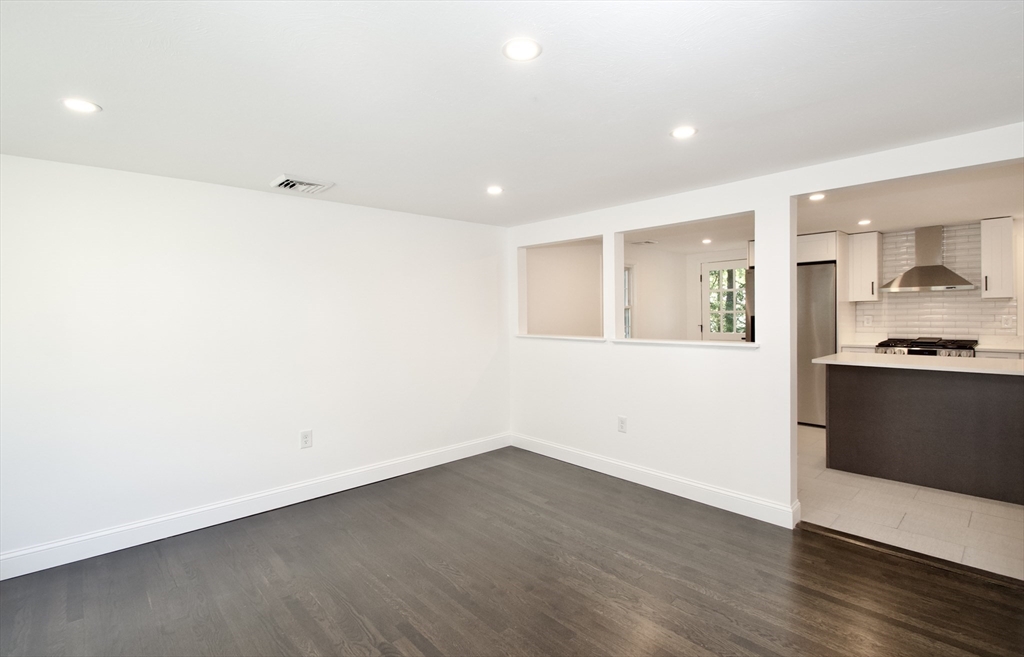 7 Barbara Road Kingston, MA 02364 - Photo 8 of 26 a view of a kitchen with wooden floor and a sink