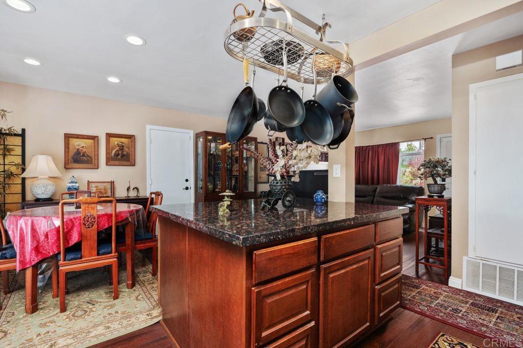 1107 Prospect Circle Vista, CA 92081 - Photo 16 of 52 a kitchen with stainless steel appliances granite countertop a sink and cabinets