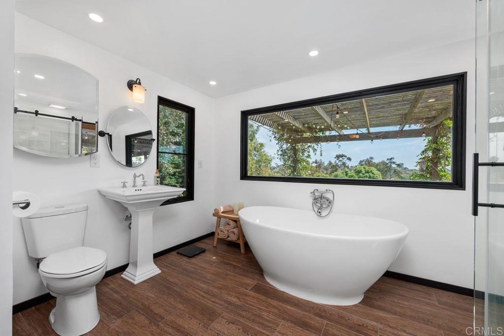 1107 Prospect Circle Vista, CA 92081 - Photo 21 of 52 a bathroom with a toilet a sink and mirror