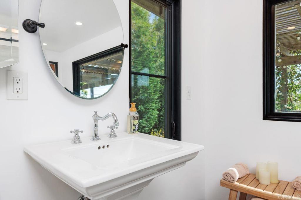 1107 Prospect Circle Vista, CA 92081 - Photo 23 of 52 a bathroom with a sink and a mirror