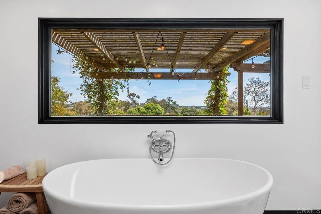 1107 Prospect Circle Vista, CA 92081 - Photo 25 of 52 a bathroom with a bathtub and a window