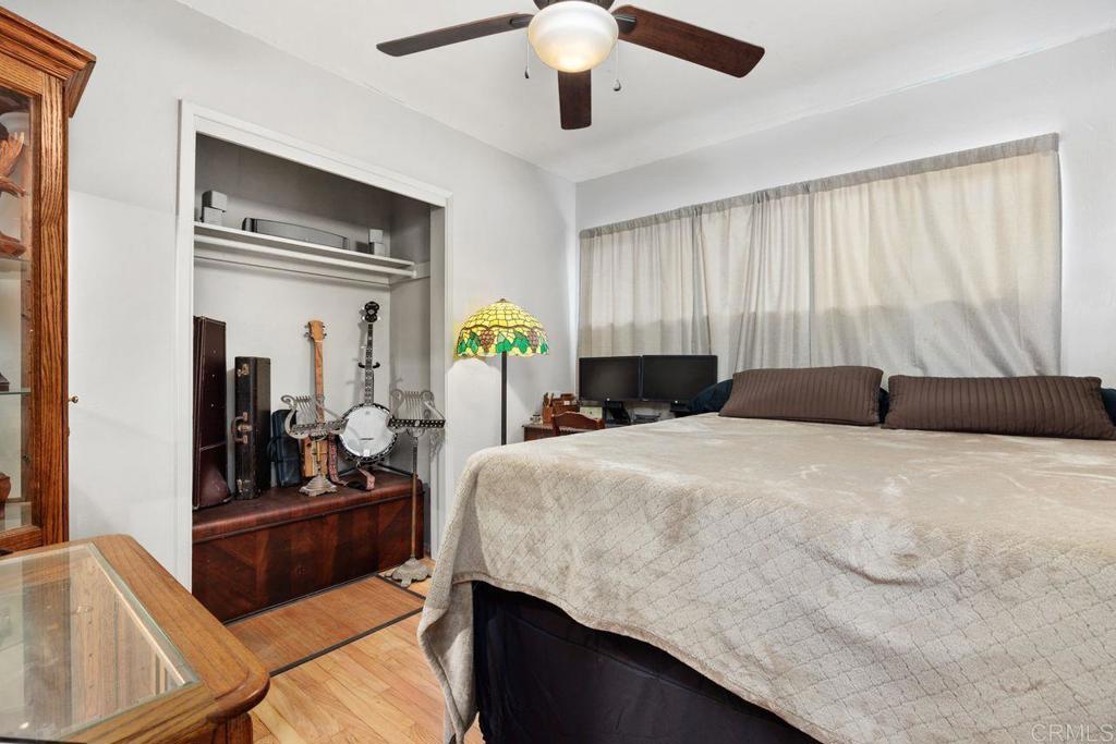 1107 Prospect Circle Vista, CA 92081 - Photo 28 of 52 a bedroom with a bed and ceiling fan