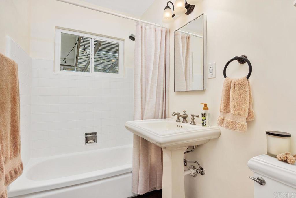 1107 Prospect Circle Vista, CA 92081 - Photo 29 of 52 a bathroom with a sink mirror and tub