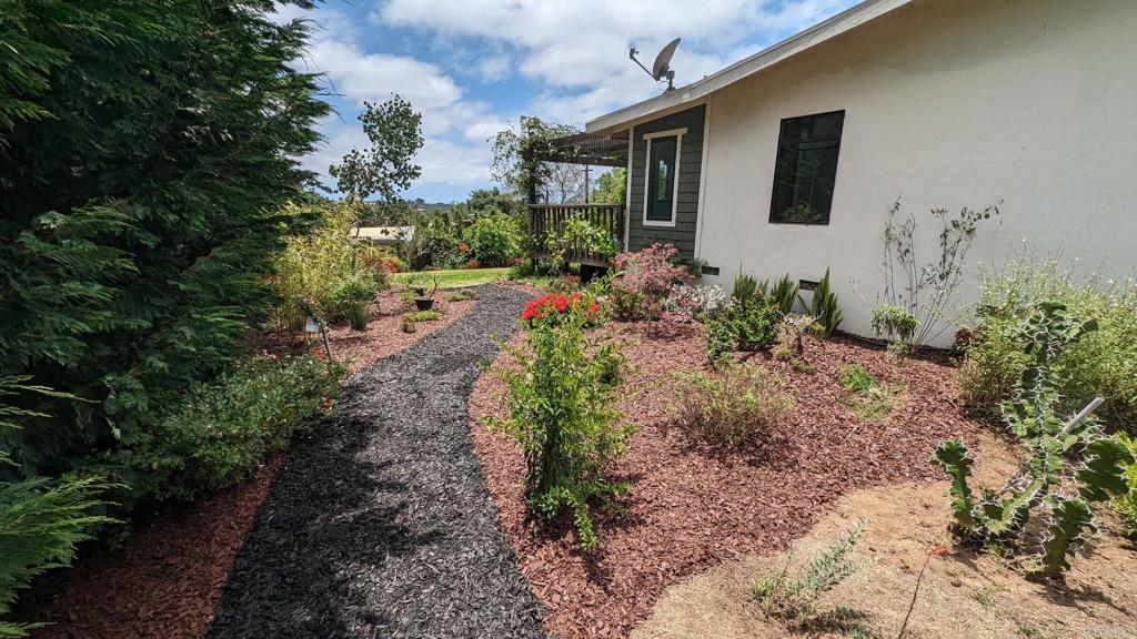 1107 Prospect Circle Vista, CA 92081 - Photo 42 of 52 a front view of a house with garden