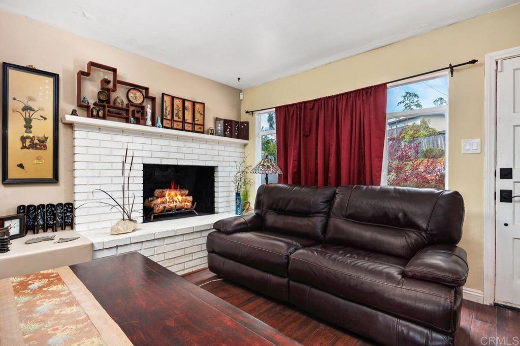 1107 Prospect Circle Vista, CA 92081 - Photo 6 of 52 a living room with furniture and a fireplace