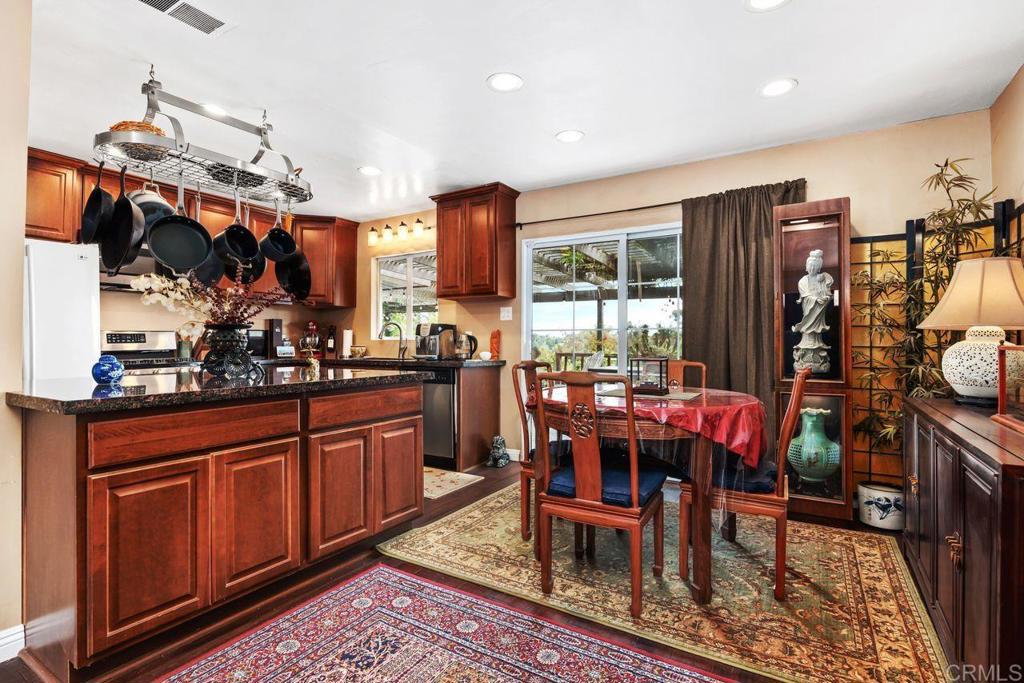 1107 Prospect Circle Vista, CA 92081 - Photo 8 of 52 a view of a dining room with furniture window and wooden floor