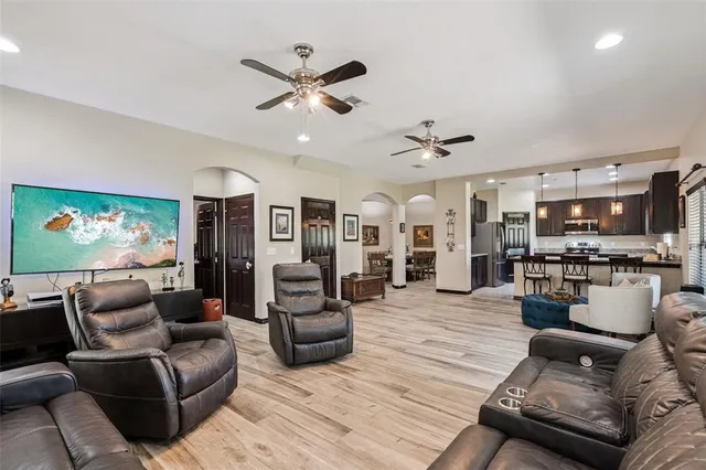 a living room with couch and a flat screen tv