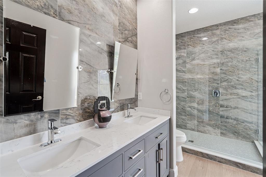 127 Verde Way DeBary, FL 32713 - Photo 15 of 77 a bathroom with double sink and a bathtub