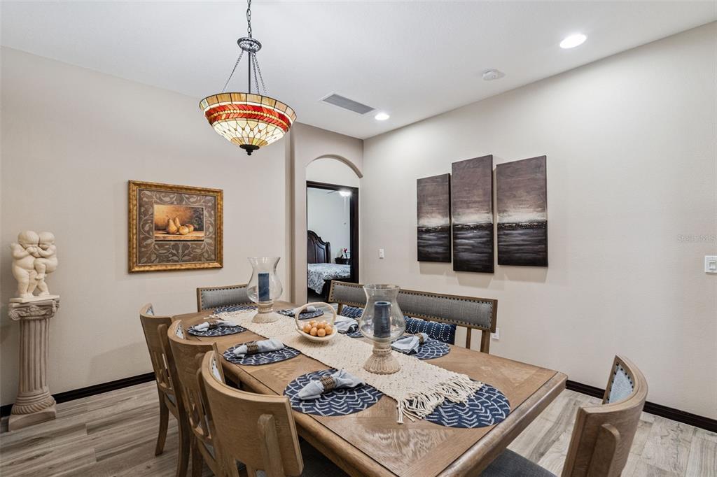 127 Verde Way DeBary, FL 32713 - Photo 19 of 77 a view of a dining room with furniture window and wooden floor