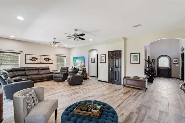 a living room with couch and a flat screen tv