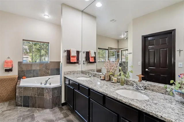 an aerial view of residential houses with outdoor space and swimming pool