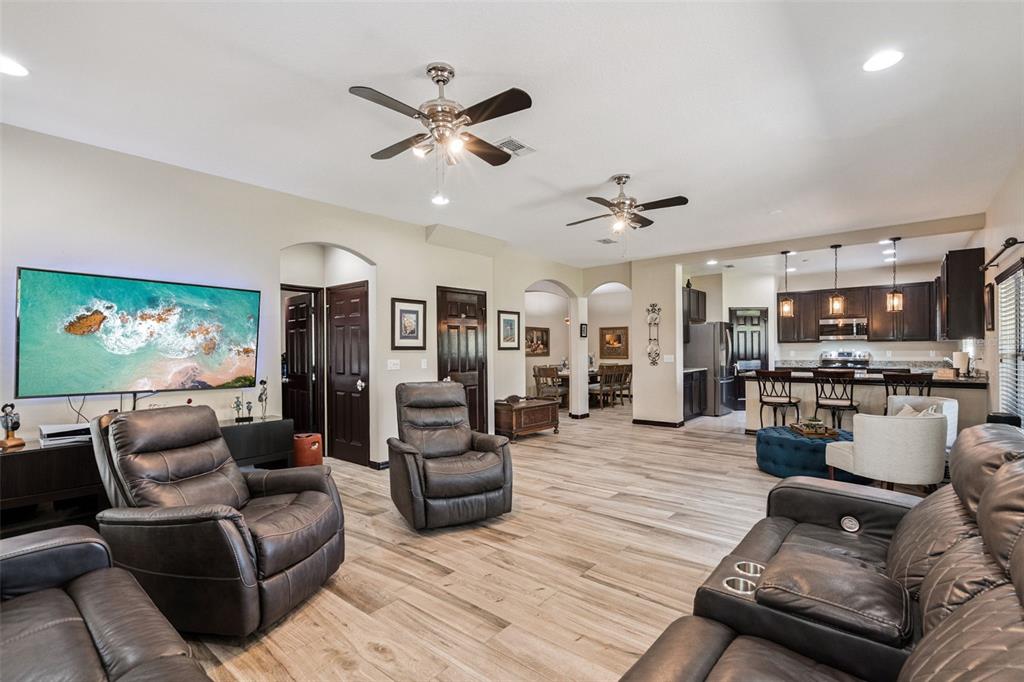 127 Verde Way DeBary, FL 32713 - Photo 22 of 77 a living room with furniture kitchen view and a flat screen tv