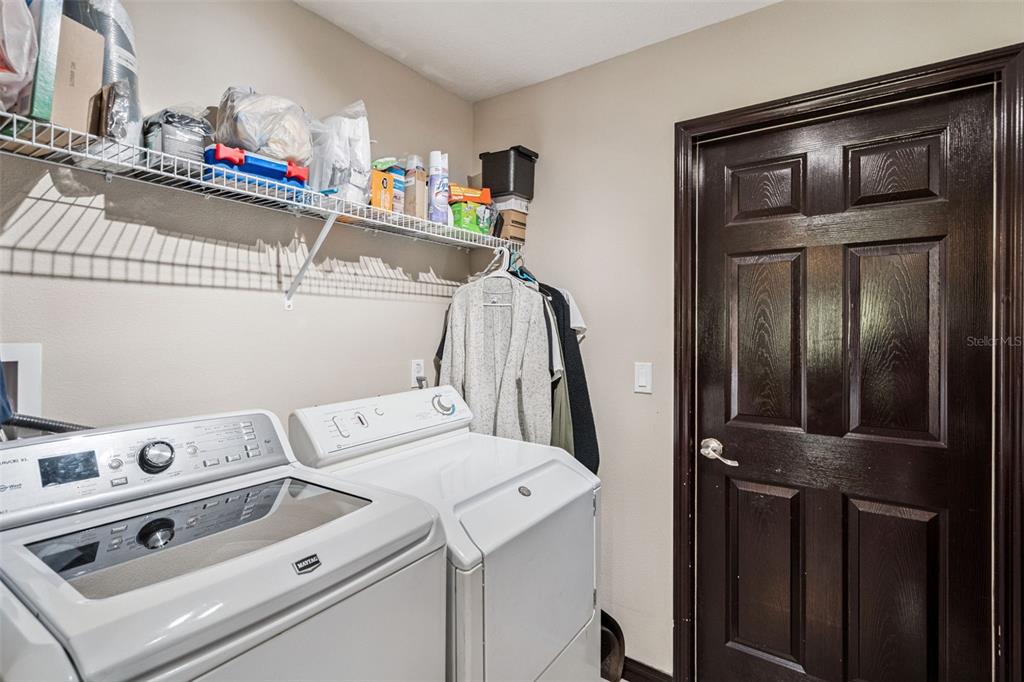127 Verde Way DeBary, FL 32713 - Photo 28 of 77 a utility room with dryer and washer