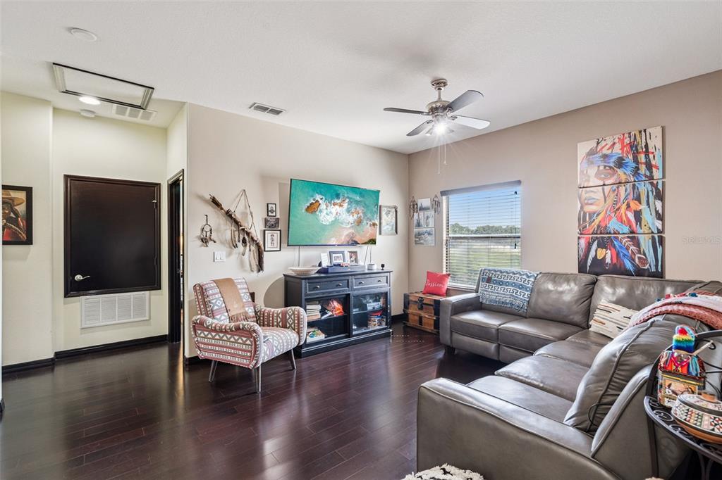 127 Verde Way DeBary, FL 32713 - Photo 31 of 77 a living room with furniture and a flat screen tv
